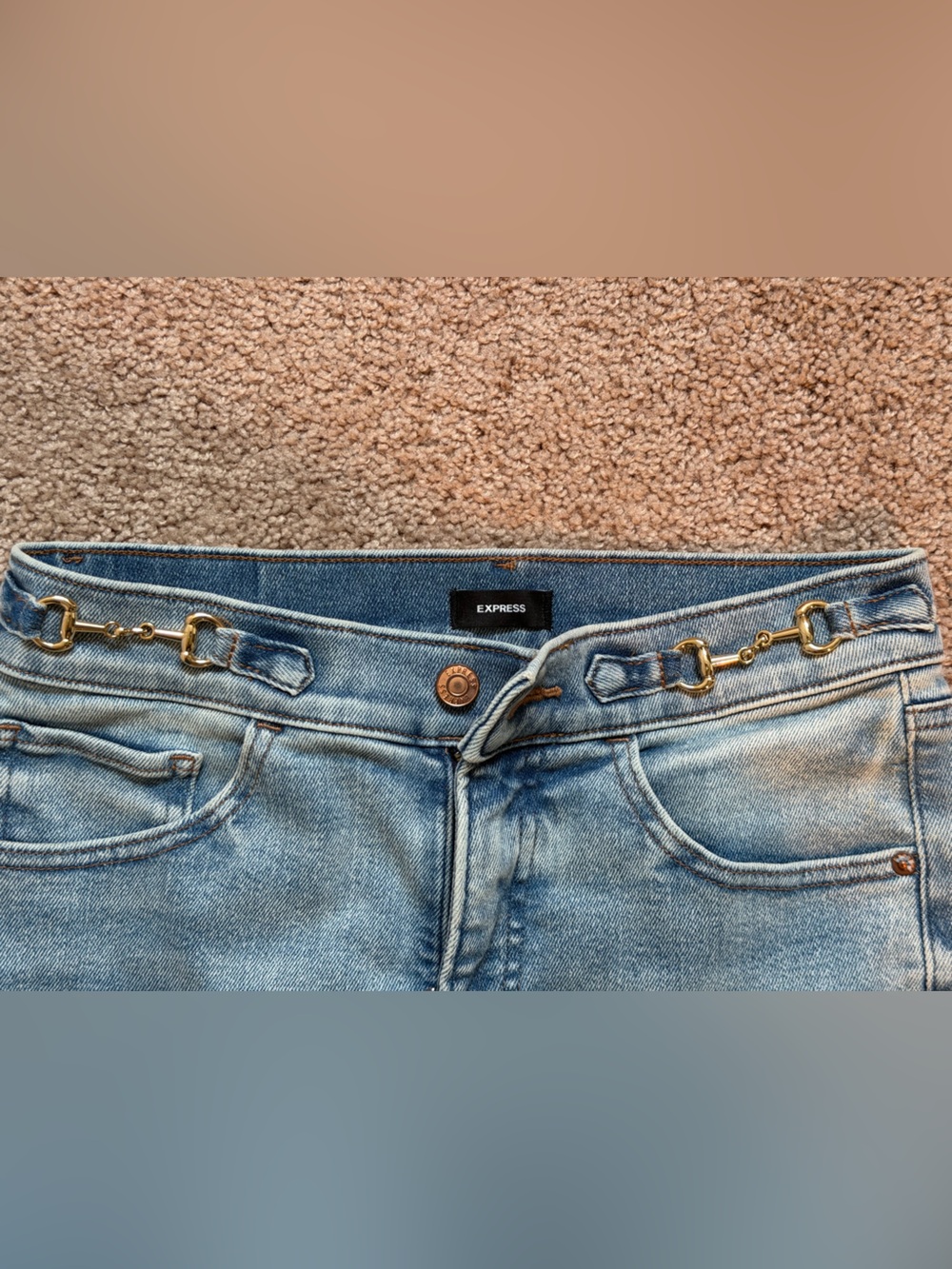 Express High-Rise Light Blue Jeans with Gold Chain Waist Detail